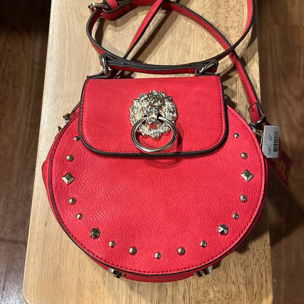 Carlos Santana sexy red bag